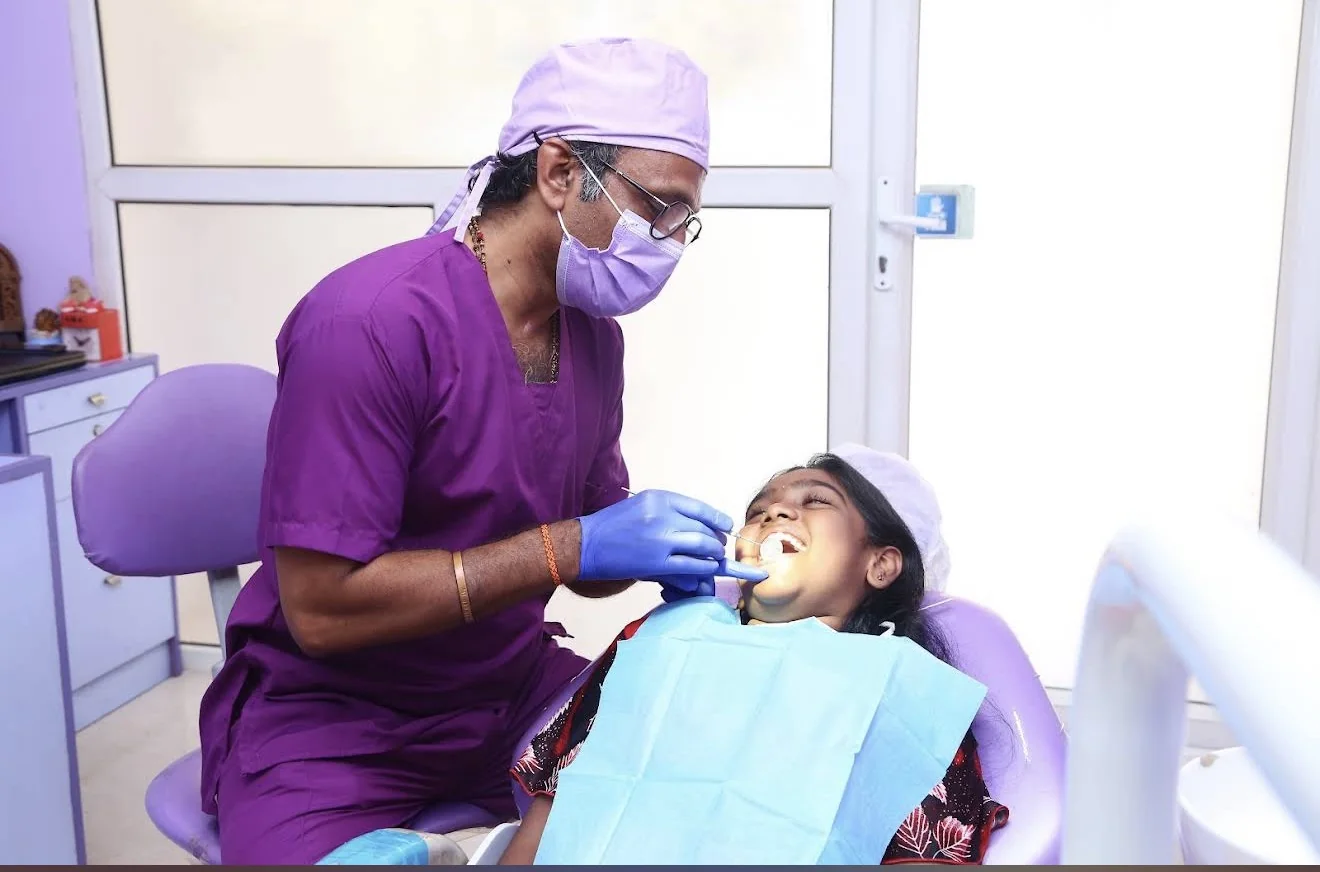 Dentist providing care to a patient in the dental chair